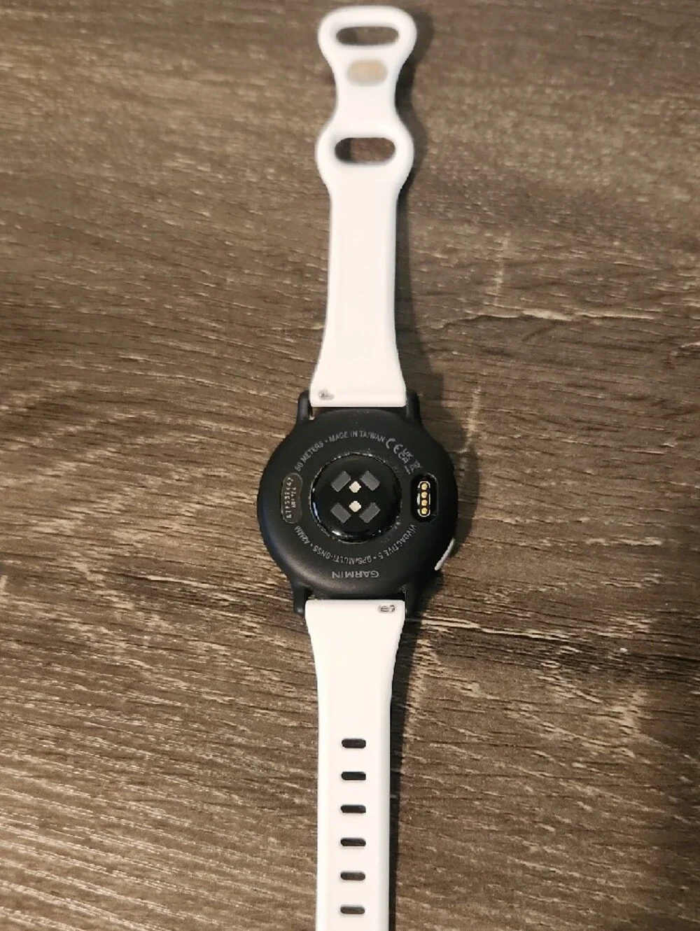 garmin white silicone smartwatch with black watch face